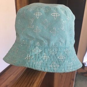 Light blue Louis Vuitton hat.